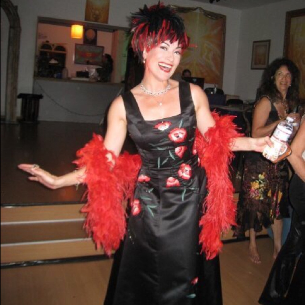 Long black satin gown with red embroidered roses.